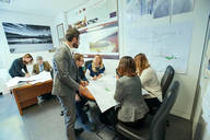 Picture of people busy in a meeting